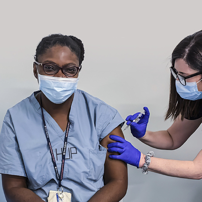 Abike James receiving vaccine